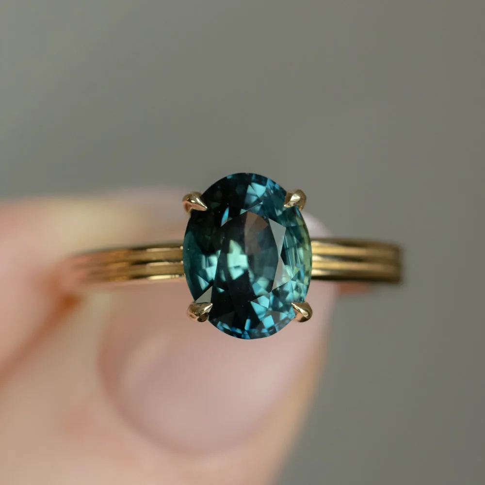 3.59ct Oval Deep Teal Madagascar Sapphire Low Profile Tri-Band "Three Winds" 4 Prong Solitaire in 14k Yellow Gold