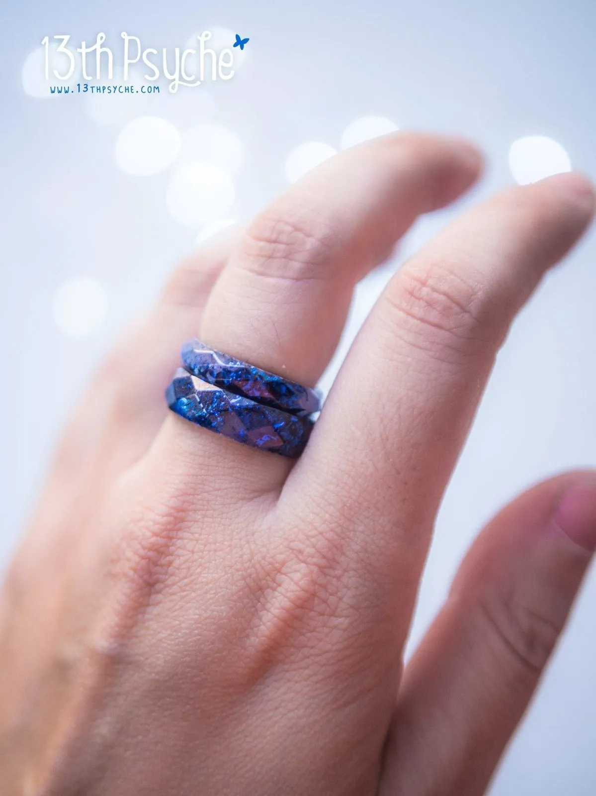 Blue and metallic blue flakes faceted resin ring