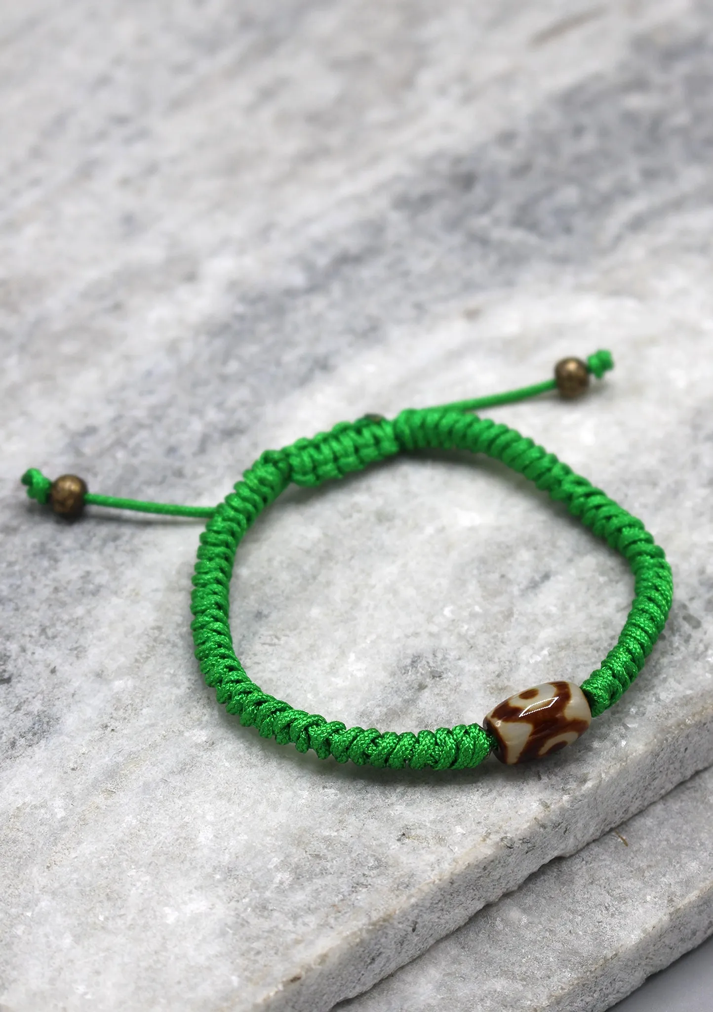 Dzi Bead on Green Lucky Knots Bracelet