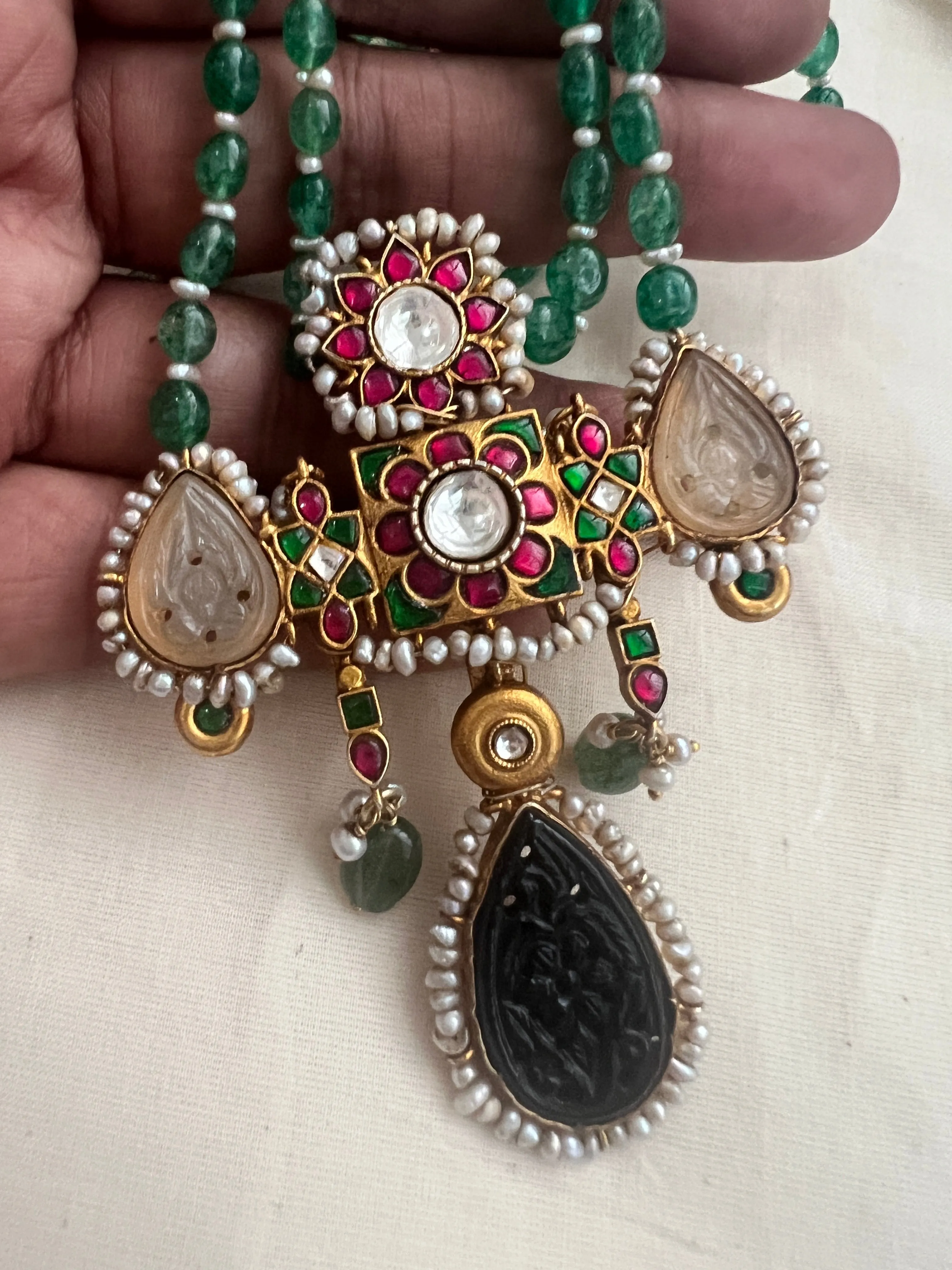 Gold polish stimulated kundan, ruby & emerald pendant,  jade & pearls beads chain