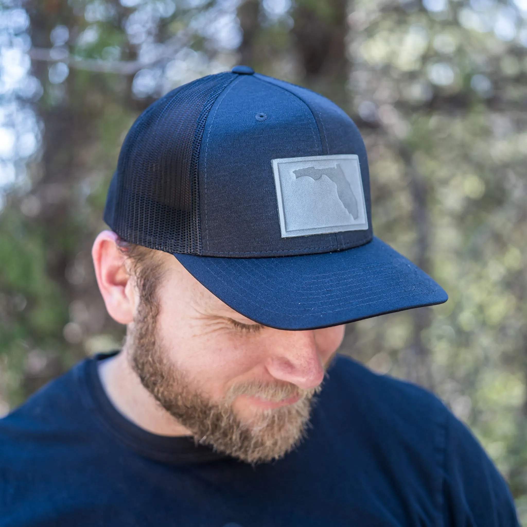 Leather Patch Performance Style Trucker Hat - Florida Stamp