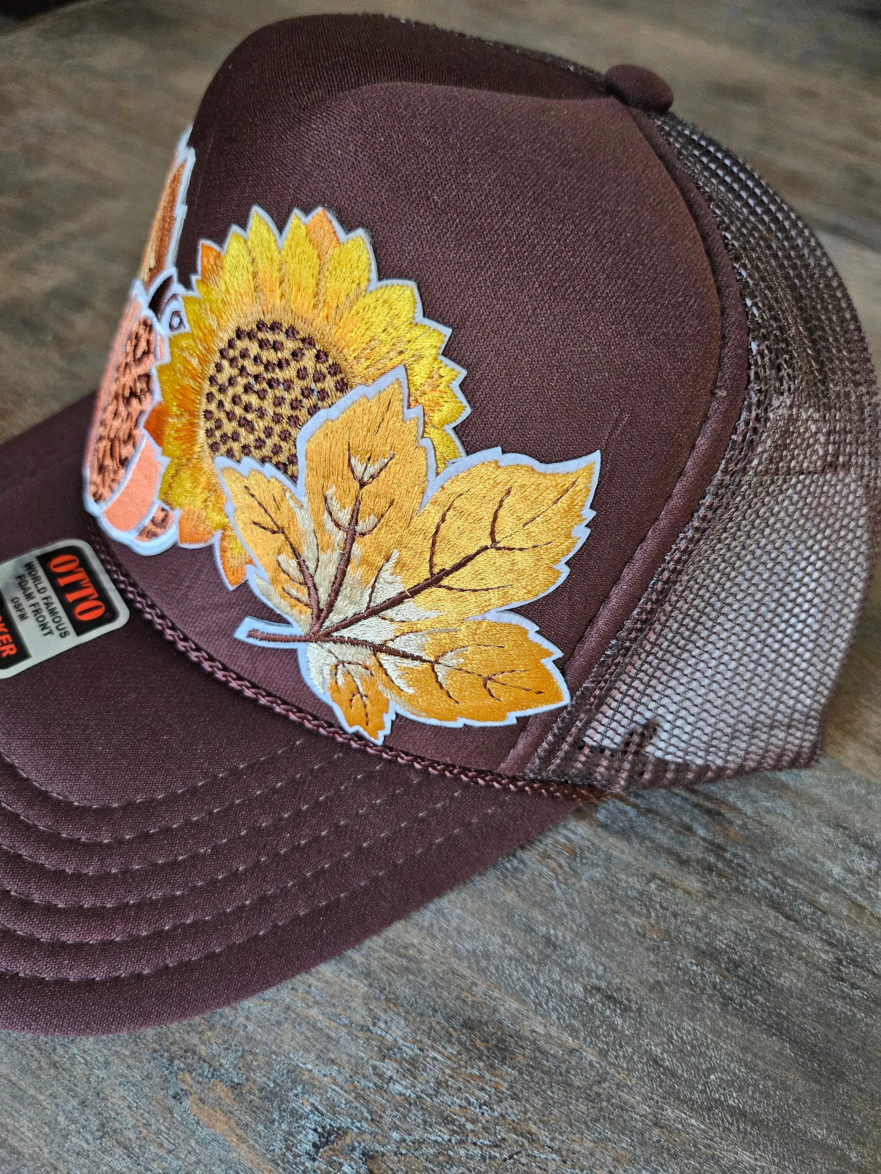 Trucker hat custom with fall leaves and sunflower embroidered patches